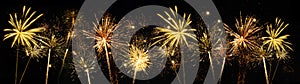 Fireworks pyrotechnics celebration party event festival holiday or New Year background panorama - Golden firework on dark night