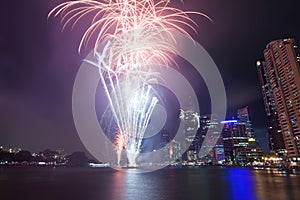 Fireworks by the river in the city