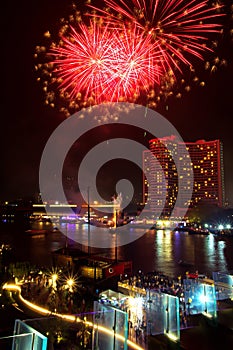 Fireworks show in Celebrate on festival day at Chao Phraya River at night time, Bangkok, Thailand. Beautiful of light