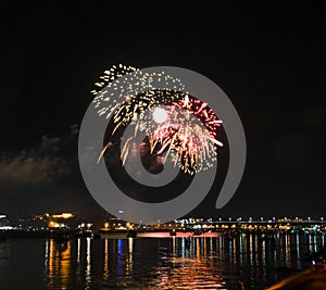 Fireworks of yellow and bright red balls of colorful droplets to