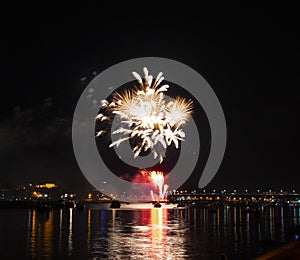 Fireworks of yellow tassels growing from bright red fountains to