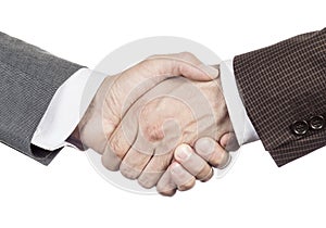 A firm handshake. Business partners shake hands. People in business suits make a handshake close-up isolated on white background.