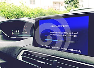 Firmware update on a modern car photo
