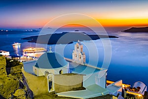 Firostefani, Santorini, Greece. Twilight with old greek church a