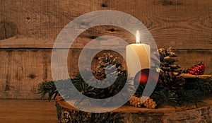 First Advent candle burning, traditional Christmas decoration