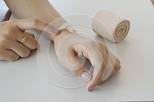 First aid accident wrist with liniment