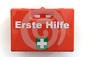 First aid box mounted on a white wall photo