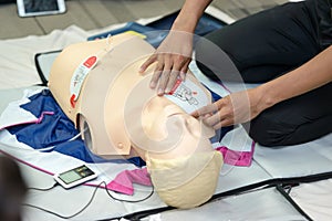First aid cardiopulmonary resuscitation course using AED training. photo