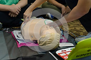 First aid cardiopulmonary resuscitation course using automated external defibrillator device - AED training. selective focus