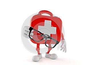 First aid kit character holding glasses