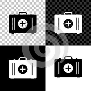 First aid kit icon isolated on black, white and transparent background. Medical box with cross. Medical equipment for