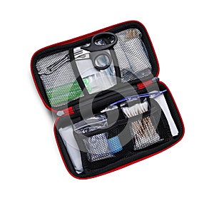 First aid kit with scissors, cotton buds and elastic bandage on white, top view