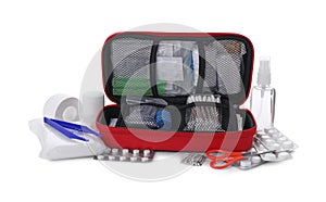 First aid kit, scissors, pins, cotton buds, pills, forceps, hand sanitizer, medical plaster and elastic bandage isolated