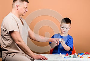 First aid. Medical help. Trauma and injurie. Medicine concept. Kid little doctor sit table medical tools. Health care