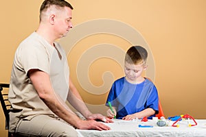 First aid. Medicine concept. Kid little doctor sit table medical tools. Health care. Medical examination. Boy cute child