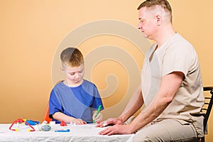 First aid. Medicine concept. Kid little doctor sit table medical tools. Health care. Medical examination. Boy cute child