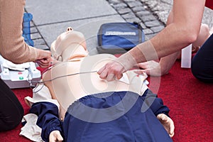 First aid training using automated external defibrillator device