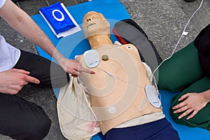 First-aider practicing chest compressions