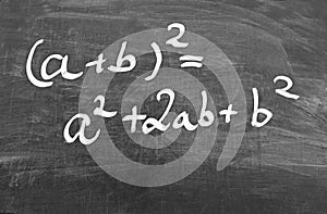 First binomial formula, written on a chalkboard