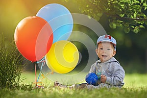 First birthday celebration of the little boy on a warm summer day in the orange light