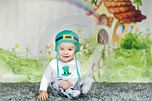 First birthday cute baby boy wearing a St. Patrick`s Day hat