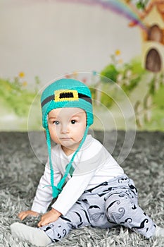 First birthday cute baby boy wearing a St. Patrick`s Day hat