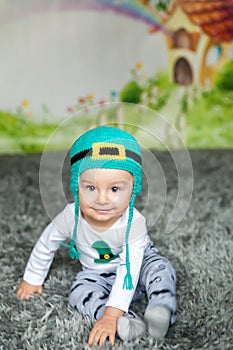 First birthday cute baby boy wearing a St. Patrick`s Day hat