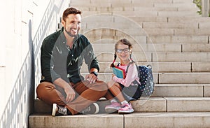 First day at school. father leads  little child school girl in first grade