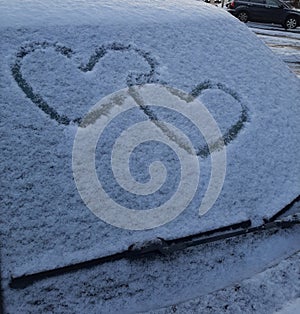 Good view in first days of new year two hearts in snow car