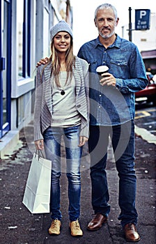 First they got coffee... then they hit the shops. Portrait of a father and daughter in the city with their shopping and