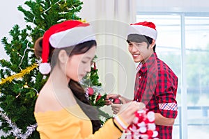 First impression of man to woman who prepare to decorating Christmas tree in New year festival. Xmas and Event concept. Love of