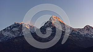 First light of the day hitting Annapurna & Annapurna South as viewed from Poon Hill summit, Nepal