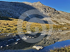 First Light on High: Sunrise Peaks lake in Vanoise National Park, Hautes Alps, France