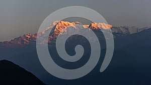 First light hitting Annapurna South and Hiunchuli as viewed from Sarangkot, Nepal