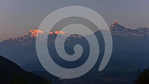 First light hitting Annapurna South and Machhapuchhre Fishtail as viewed from Sarangkot, Nepal