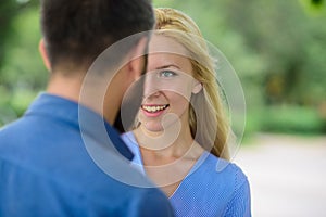 First meet of strangers, girl looks at bearded man