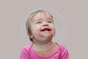 The first milk teeth in children, erupted, small child happy photo