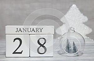 First month of the year, a calendar with numbers and a month, January 28. New Year`s fairy tale as a keepsake