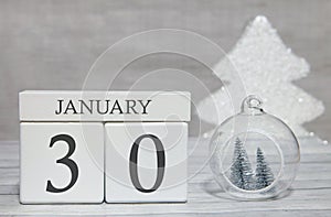 First month of the year, a calendar with numbers and a month, January 30. New Year`s fairy tale as a keepsake