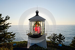 First order Fresnel lens catching the light of setting sun at Cape Meares Oregon