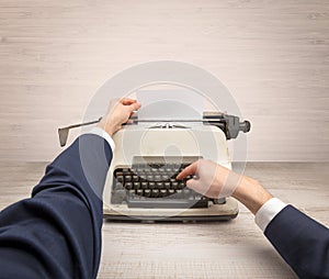 First person perspectve hand writing on an oldschool typewriter