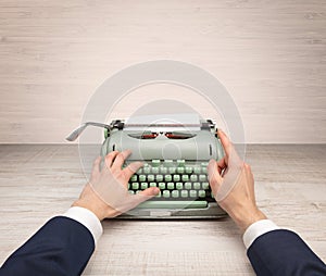 First person perspectve hand writing on an oldschool typewriter