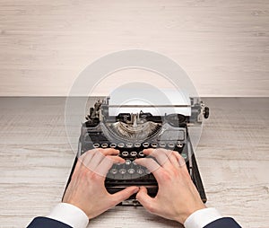 First person perspectve hand writing on an oldschool typewriter