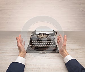 First person perspectve hand writing on an oldschool typewriter