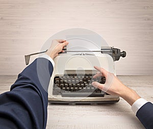 First person perspectve hand writing on an oldschool typewriter