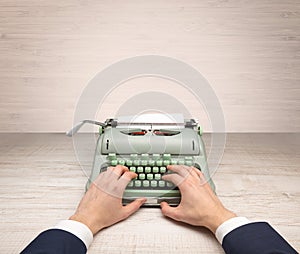 First person perspectve hand writing on an oldschool typewriter