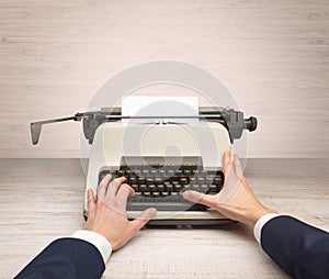 First person perspectve hand writing on an oldschool typewriter