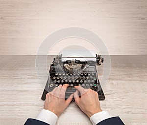 First person perspectve hand writing on an oldschool typewriter