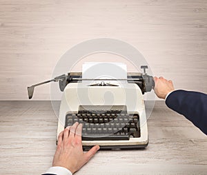 First person perspectve hand writing on an oldschool typewriter