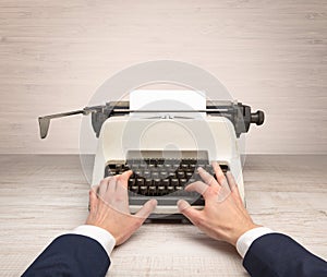 First person perspectve hand writing on an oldschool typewriter